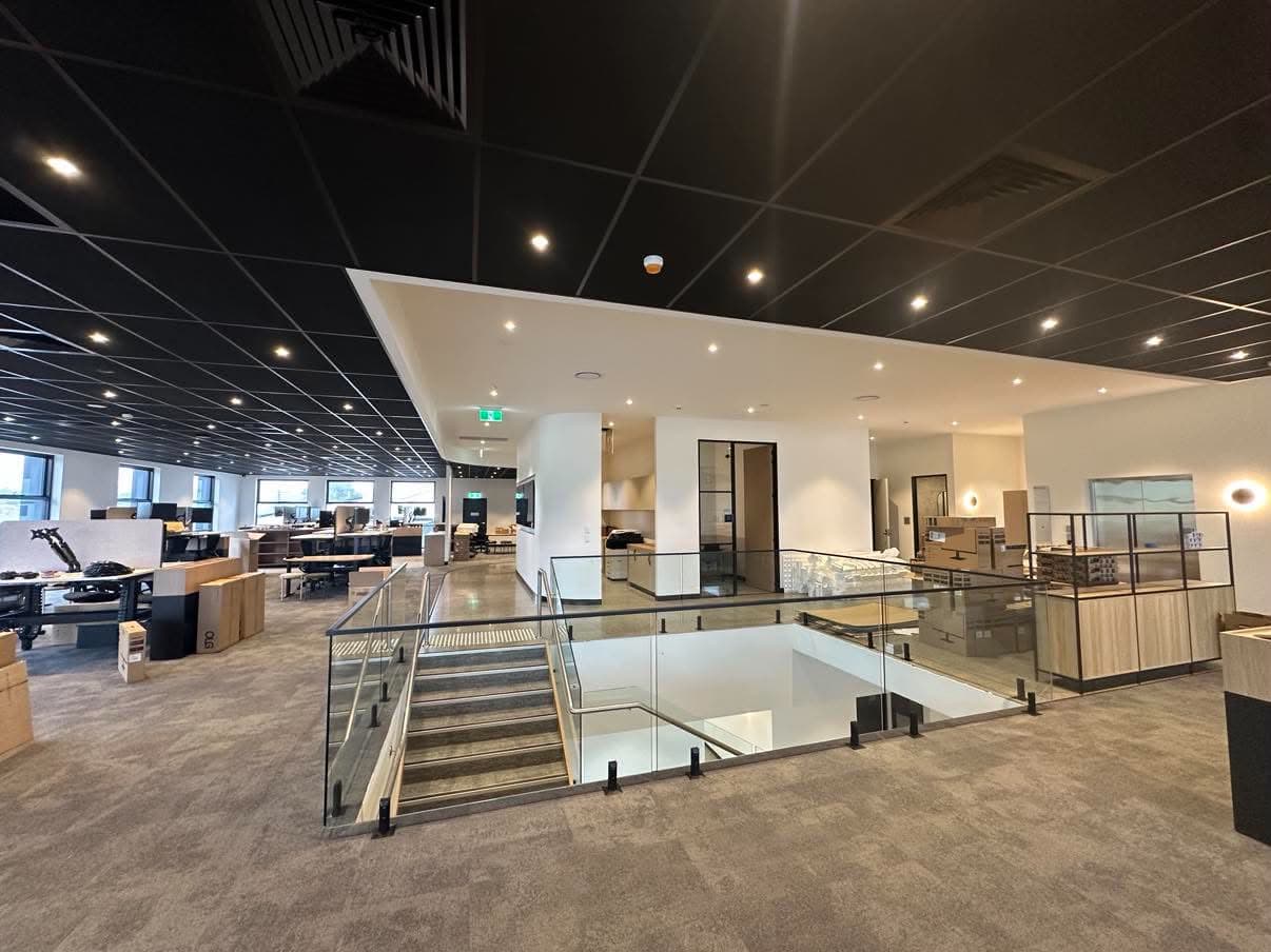 Painted multi-level office fit-out with central stair void